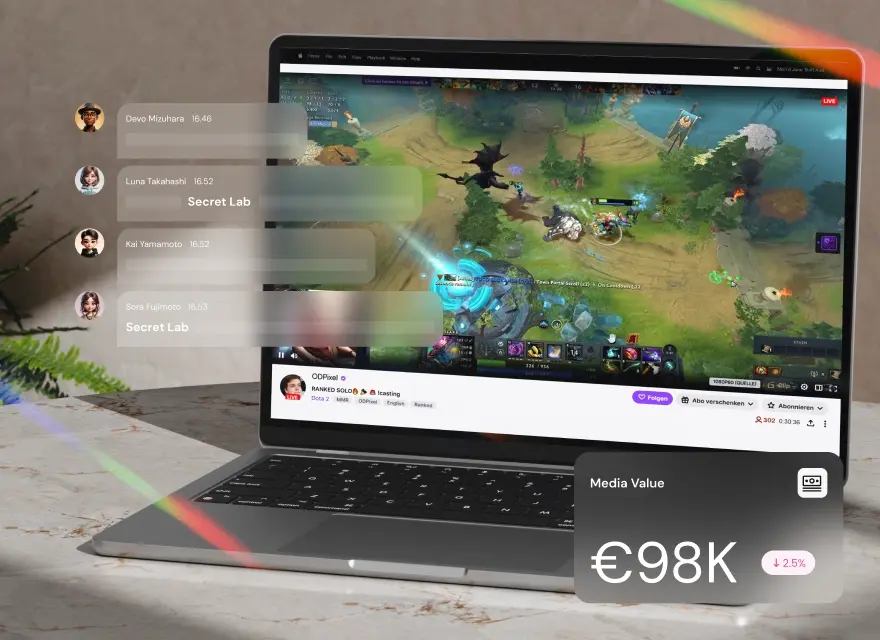 A laptop streaming a MOBA esports match, with overlaid chat messages highlighting sponsor mentions and a media value of €98K.