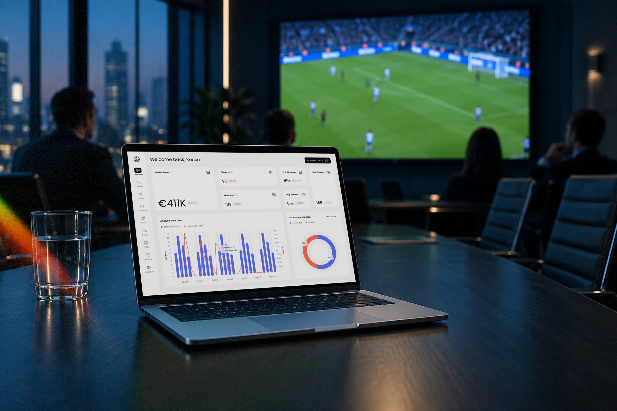 Laptop showing the Shikenso sponsorship analytics dashboard in a dark boardroom, with a football match on the wall screen behind it.