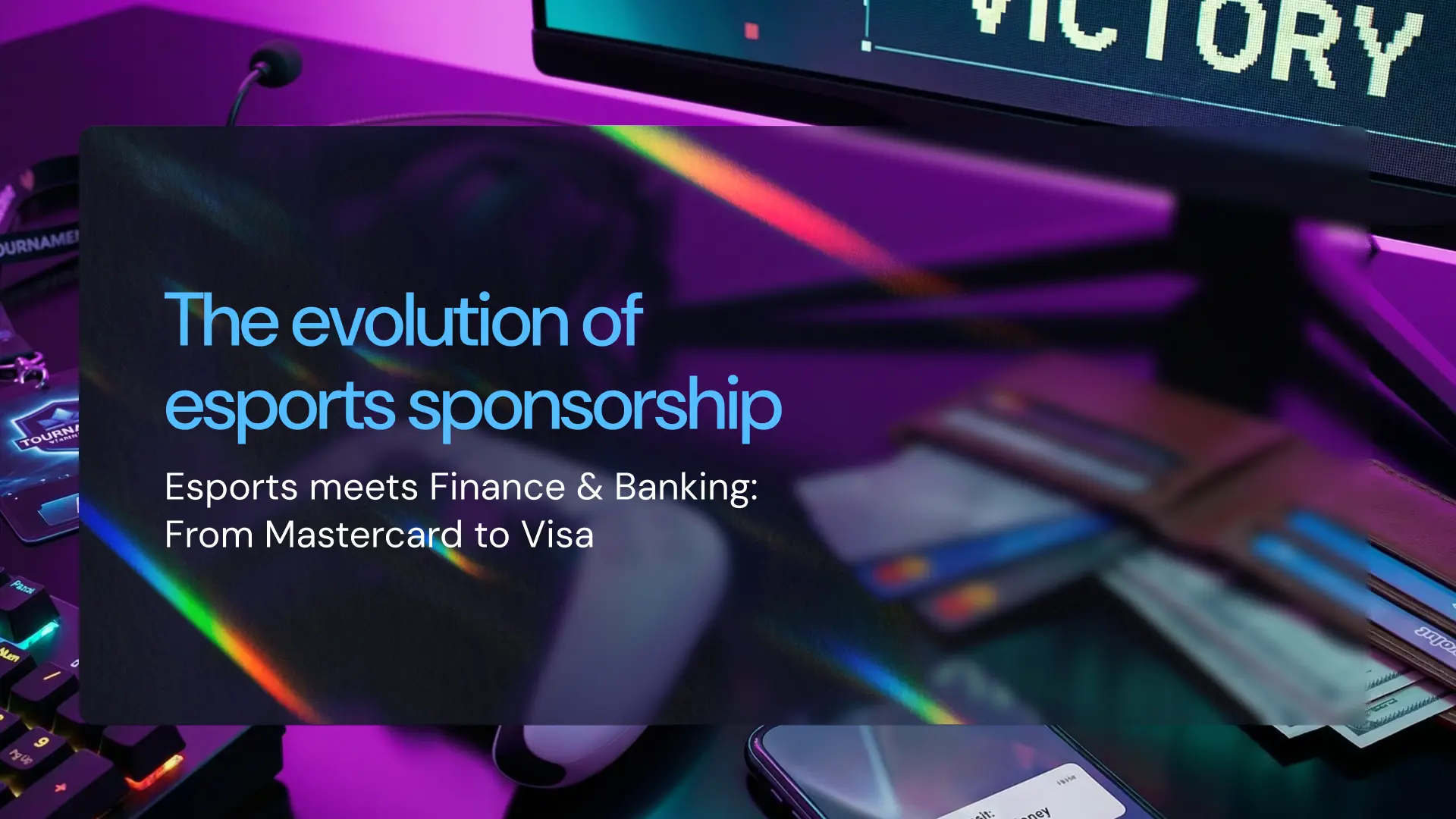 Esports desk setup with payment cards and a monitor, illustrating the evolution of esports sponsorship as finance and banking brands expand into esports.