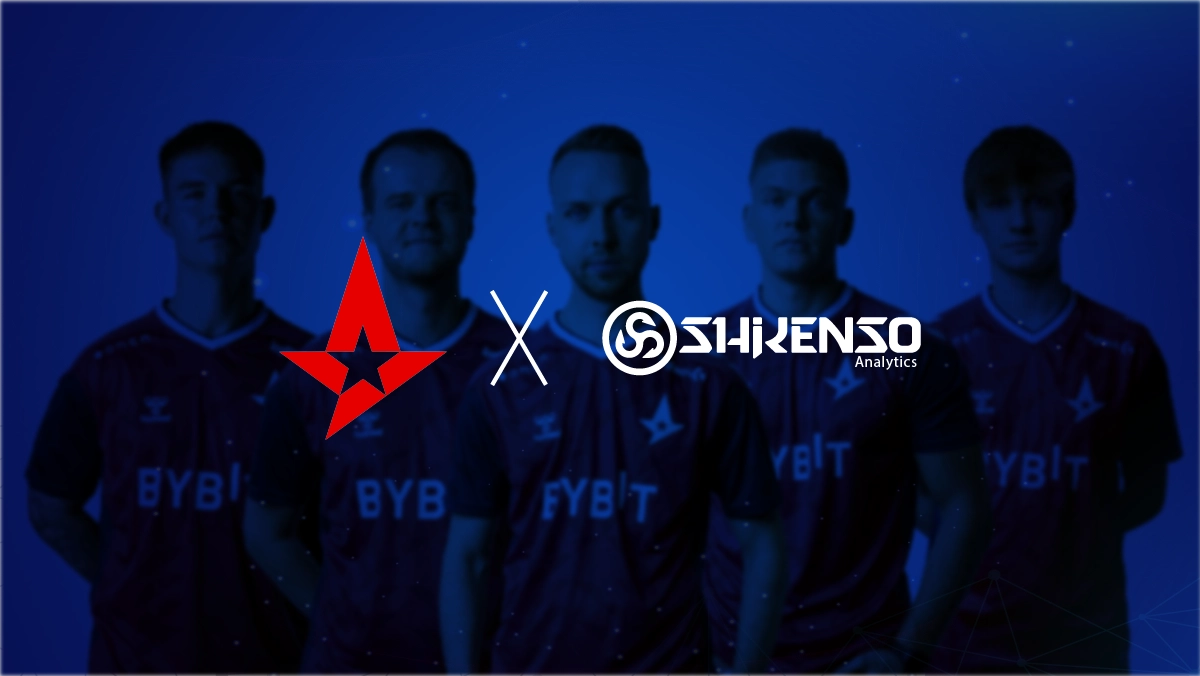 Partnership graphic showing the Astralis logo on the left and the Shikenso Analytics logo on the right, separated by an 'x'. In the background, Astralis esports players wearing red jerseys with 'BYBIT' sponsor branding are visible against a blue gradient backdrop.