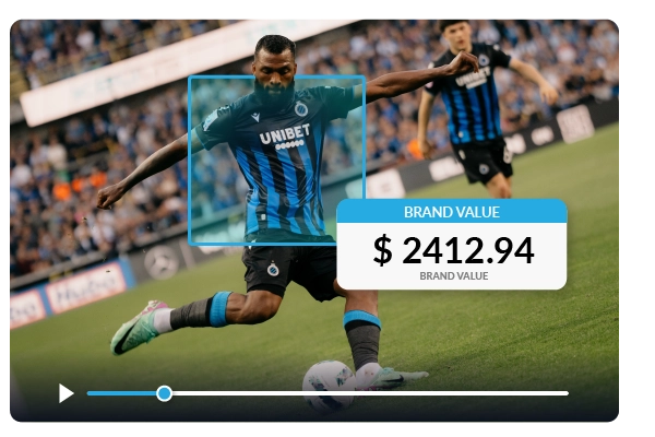 Football player on the pitch with overlaid brand value analytics, illustrating real-time sponsorship measurement and digital media valuation in sports marketing.
