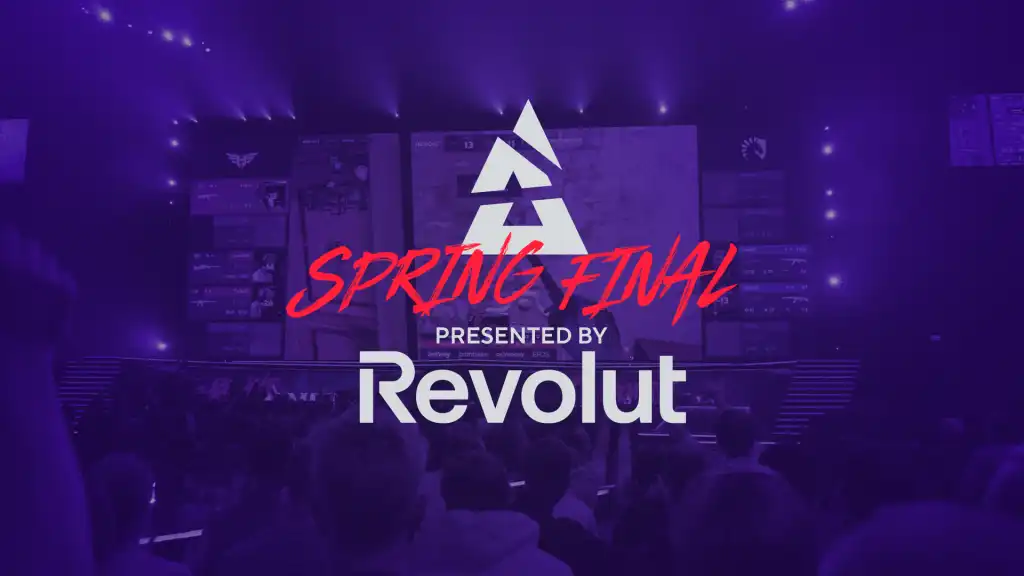 “Esports arena stage during a Spring Final event, featuring tournament branding and a ‘Presented by Revolut’ sponsorship title displayed on large screens above a live audience.
