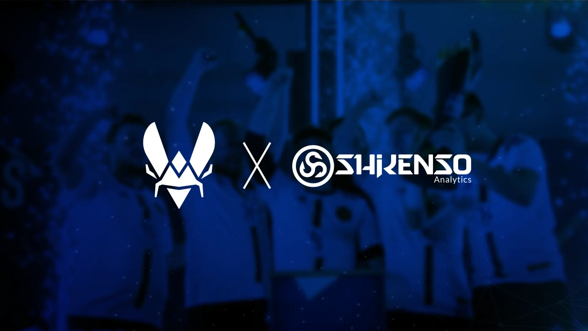 Partnership announcement graphic featuring Team Vitality’s logo on the left and Shikenso Analytics’ logo on the right, with a celebratory esports team in the background.