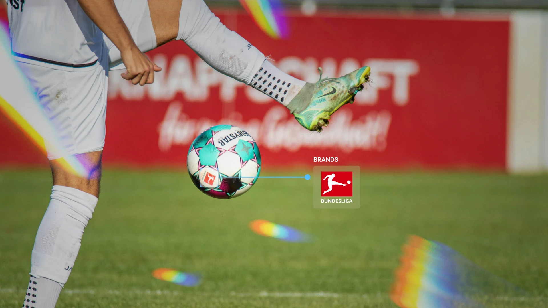 A close-up of a soccer player kicking a ball during a match, with the Bundesliga logo highlighted to represent brand association in sports. The image symbolizes how Sponsorship Measurement tracks brand visibility and engagement through on-field exposure and logo placement in professional sports environments.
