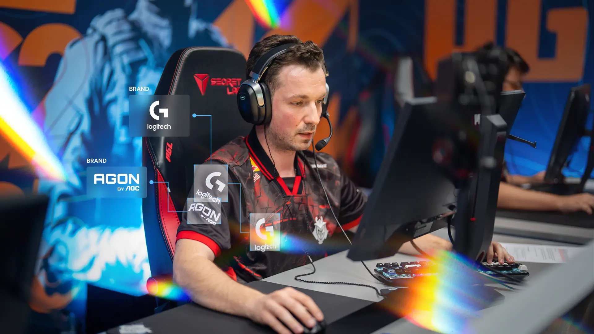 Esports player competing on stage with multiple brand overlays, showing how AI logo detection identifies sponsor logos and tracks exposure during live gameplay.